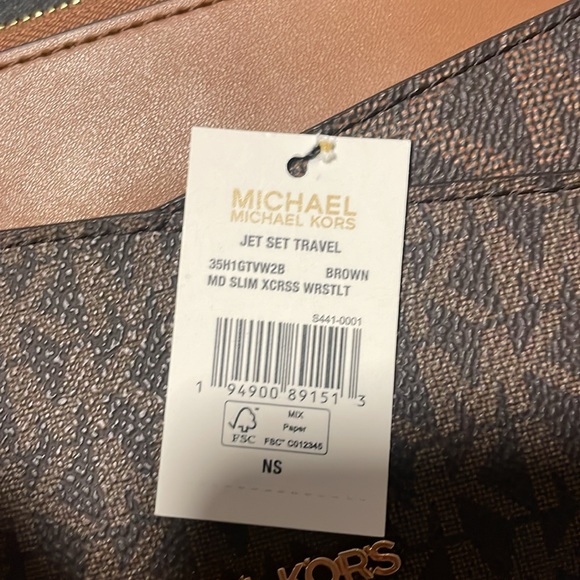$50 EACH Michael Kors wristlet. Available in black, pink, and brown. - Picture 2 of 5